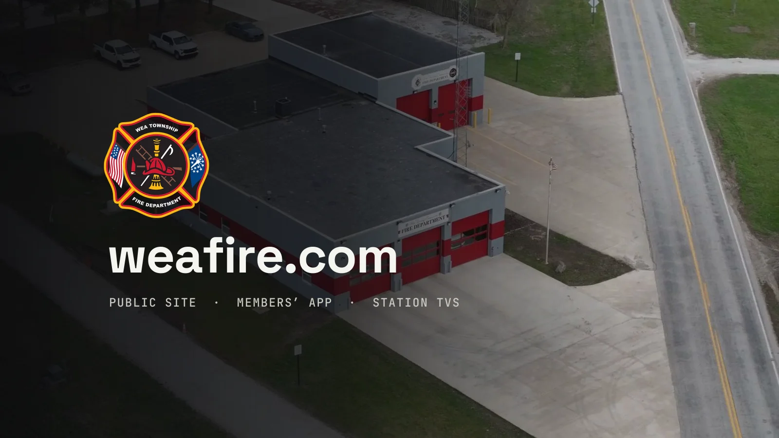 An aerial view of the Wea Township fire station with the department badge and weafire.com.